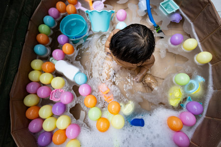 Children Playing In An Outdoor Bathtub, Background for advertising and wallpaper in summer and lifestyle scene.の写真素材
