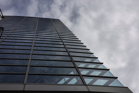 Repeating Pattern On Office Building Facade, A repeating pattern adorns the floor, shot from a low...