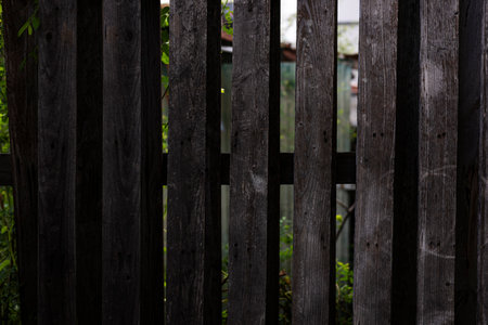 Wooden Sun Blocking Fence Wall, A rustic ad photo of a wooden sun blocking fence wall, warm planks casting soft shadows, perfect for a garden campaign or cozy outdoor documentary.の写真素材