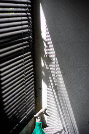 Light And Shadow Through Window Blinds, A dramatic photo of light and shadow through window blinds,...
