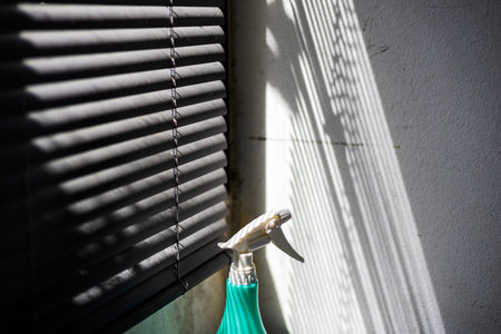 Light And Shadow Through Window Blinds, A dramatic photo of light and shadow through window blinds,...