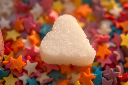 colorful sugar stars coating with white shugar heart on itの写真素材