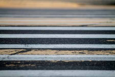 white and yellow zebra crossing with blurs on the edgesの写真素材