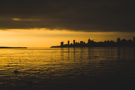 water pollution in a river during the sunsetの写真素材