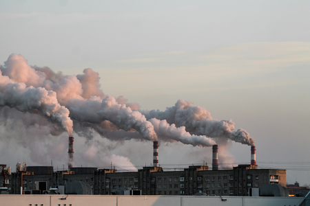 industrial chimneys with heavy smoke causing air pollution problemの写真素材