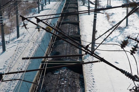 rail cars loaded with coal being transported from nearby mines to power plants in winterの写真素材