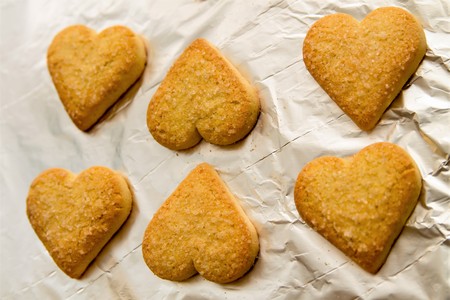 flatlay of heart shaped fresh baked cookies as a symbol of St. Valentines Dayの写真素材