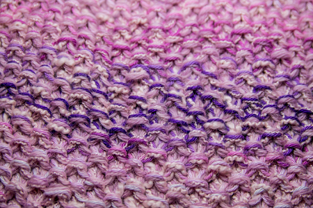 Pink, white and violet striped knitted texture backgroundの写真素材