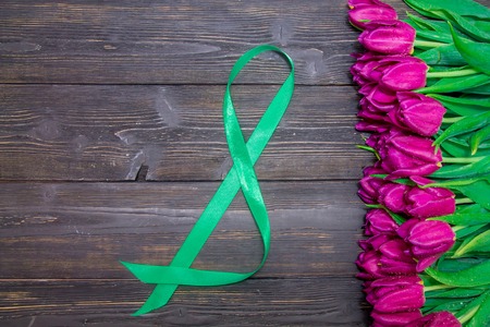 Womens Day copy space with bright pink tulips on a black wooden background , texturesの写真素材