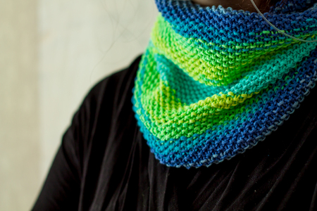 a knitted textured snood on a girl's neck close upの写真素材