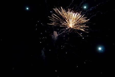Golden fireworks on a black background, Fireworks explode, fireworks background, light show, close-upの写真素材