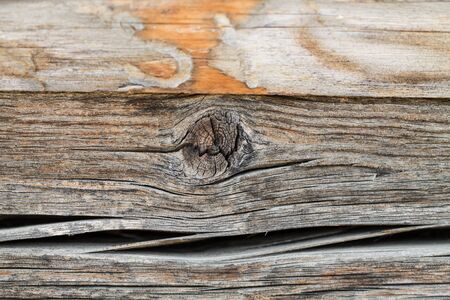 beautiful extravagant wooden pattern on old wooden board with traces of snags on a flat surface as a backgroundの写真素材