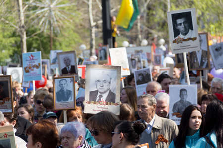 KHABAROVSK, RUSSIA - MAY 9, 2017: a March of Immortal Regiment, devoted to the Victory in the great Patriotic war. People marching after the militari parade wih their fathers and granddads photos making a big regimentのeditorial素材