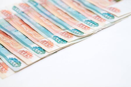 Copy space with Russian money banknotes rows of five thousand and one thousand rubles on white backroundの写真素材