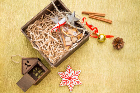 Merry Christmas flatlay with golden copy space background with gifts, Xmas balls, toys, sugar canes and black copy space.の写真素材