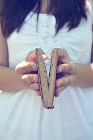 girl holding bookの写真素材