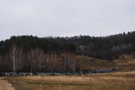 old village cemetery under the hillの写真素材
