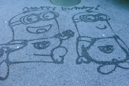 OSAKA, JAPAN-JAN 07, 2017: Photo of "HAPPY MINION" Street Water Painting Art, located in Universal Studios JAPAN, Osaka, Japan. Minions are famous character from Despicable Me animation.のeditorial素材