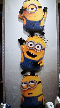 OSAKA, JAPAN - Nov 13, 2019 : Close up HAPPY MINION statue in Universal Studios Japan. Minions Are Famous Character from Despicable Me Animation.のeditorial素材