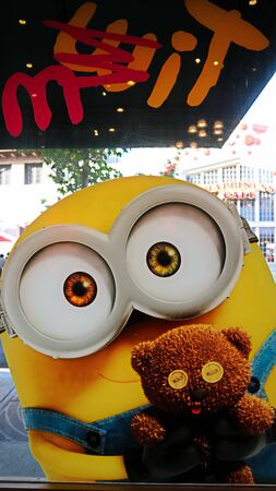 OSAKA, JAPAN - Nov 13, 2019 : Close up HAPPY MINION statue in Universal Studios Japan. Minions Are Famous Character from Despicable Me Animation.のeditorial素材