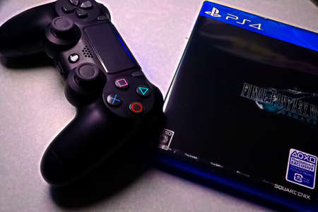 Osaka, Japan - Apr 10,2020 : View of Final Fantasy 7 Remake Game software packages with PS4 Joystick.Remade for the first time in 26 years and released worldwide at the same time.のeditorial素材