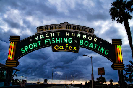 Los Angeles,CA/USA - Oct 29, 2015 : Welcoming arch in Santa Monica, California. The city has 3.5 miles of beach locations. Santa Monica Pier, Picture of the entrance with the famous arch sign.のeditorial素材