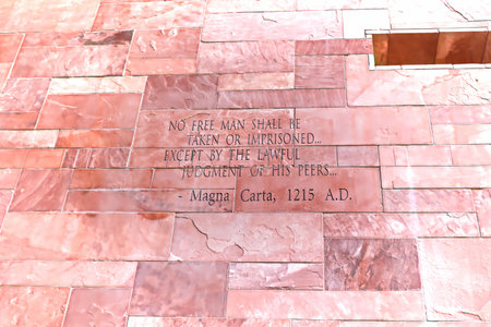 Article of Magna Carta text on of the old brick wall