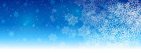 Winter snowflakes on blue background - horizontal panoramic banner for Christmas and New Year holiday designの写真素材