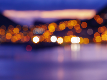 Blurry city lights during sunset. Lense flairs. flat layの写真素材