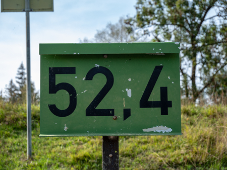 Image of an old sign with numbers on it close upの写真素材