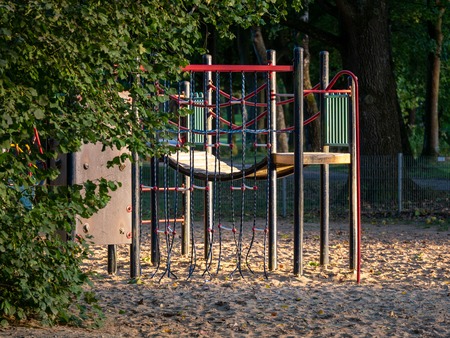 Image of wooden playgound on sandy ground during dawnの写真素材