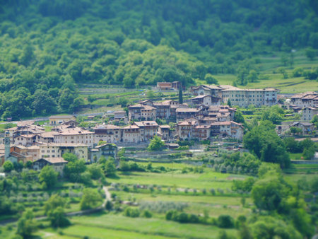Tilt shift image of mountain village in italy near lake gardaの写真素材