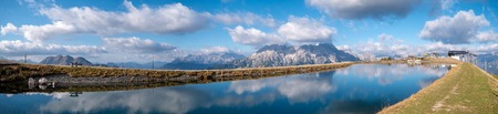Image of mountain panorama with water reflections in lake in austriaの写真素材