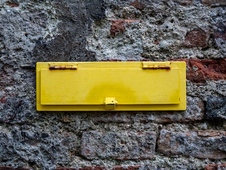 Image of mailbox in a brick wall with beautiful coloursの写真素材