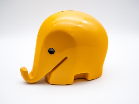 Image of a yellow piggy bank with white background close upの写真素材