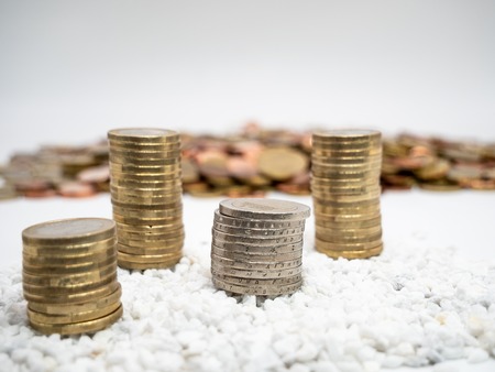 Image of pile of two Euro coins on white little stones close upの写真素材