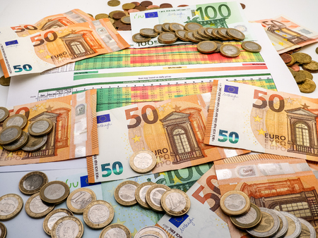Image of money investment strategy with coins and euro bills close upの写真素材