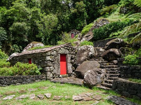 Image of old stone houses based on a hill landscape on the Azoresの写真素材