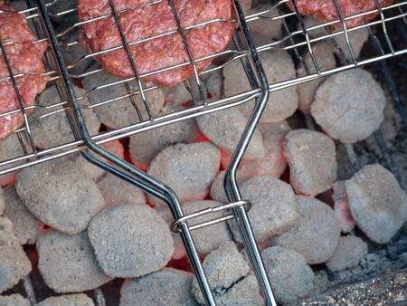 Image of bbq burger patties on grillの写真素材