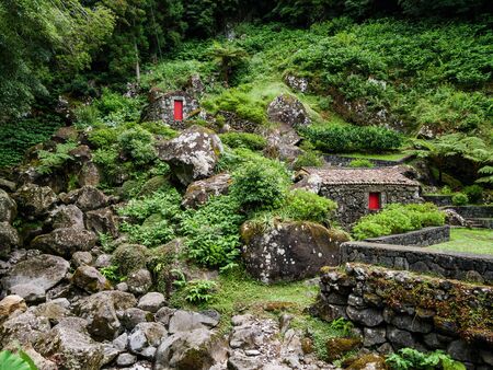 Image of old stone houses based on a hill landscape on the Azoresの写真素材