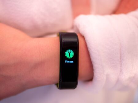 Image of woman wrist with fitness smart watchの写真素材