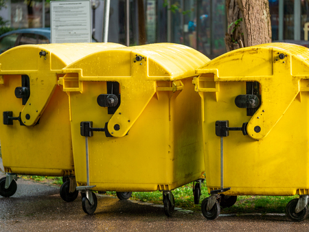 Image of Yellow waste Containers, Recycling bin for special Rubbish, during hail and rainy weather, close upの写真素材