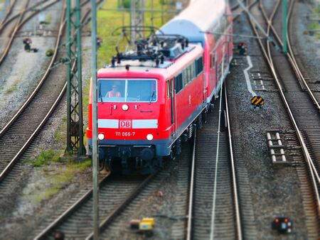 Augsburg, Germany - September 5, 2018: Red train from the German railway operator German railways Deutsche Bahn DB is leaving the central station in Augsburgのeditorial素材