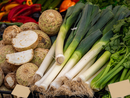 Close up view on fresh organic celery and leel and other vegetables at a market
