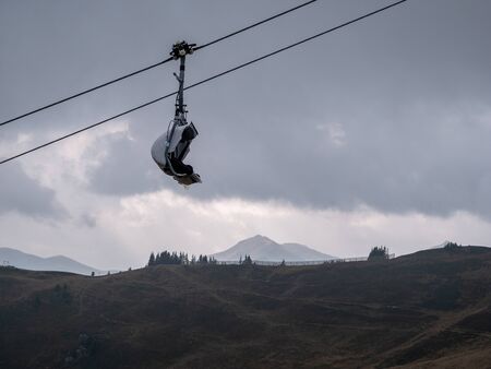 Image of chairlift and ski resort without snow in the off seasonの写真素材