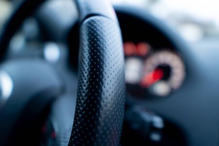 Close up shot of a speedometer in a car. Car dashboard. Dashboard details with indication lamps.Car instrument panel. Dashboard with speedometer, tachometer, odometer. Car detailing.の写真素材