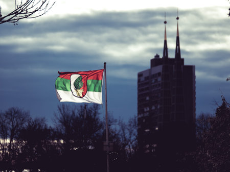 Augsburg, Germany - December 15, 2019: Illuminated flag of the soccer club FC Augsburg flatters in...