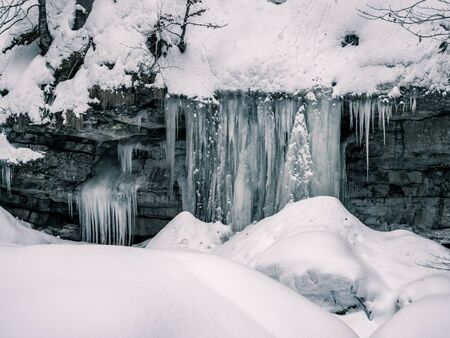 The Breitachklamm ravine in winter time with long icicles in Tiefenbach near Oberstdorf, Bavaria, Germanyの写真素材