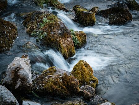 Long exposure waterfall over rocks in forest landscape, Germanyの写真素材