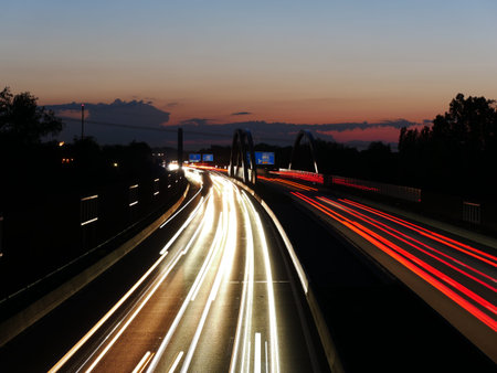Long exposure image of the German Autobahn A8 near Augsburg during sunset.